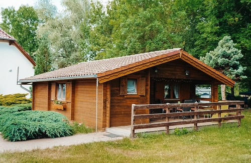 Priepert House | Wooden house directly on the lake