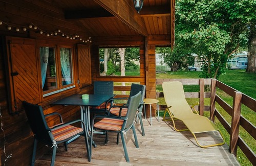 Priepert House | Wooden house directly on the lake
