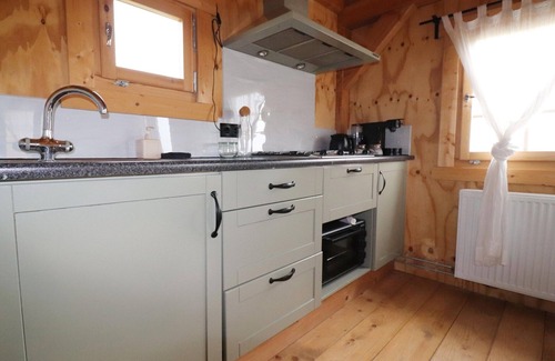 Tjerkgaast House | Wooden House in Friesland with Farm Experience