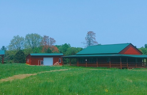 Gerry Cabin | Woodys Retreat this rental includes the barn outdoor covered fire pit
