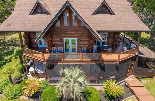 Manning House | Wyboo Lakefront Premier: Log Cabin on the Water!