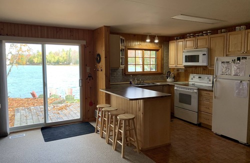 Trent Lakes Cottage | Yellow Cottage Sandy Lake Buckhorn. Beautiful turquoise water, water equipment.