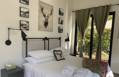 Dysart et al Cottage | You cannot get closer to the lake than this cozy and chic Redstone Lake cottage!
