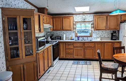Coloma House | You'll love sipping a drink on the deck while enjoying views of Paw Paw Lake.
