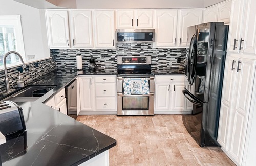 Conneaut Lake Apartment | Your Conneaut Lake Getaway: Comfy 3BR Duplex, Hot Tub, Fenced Yard!