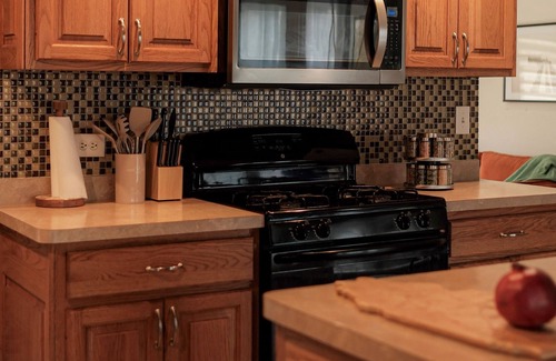 Streamwood House | Your Cozy Getaway with Sunroom & Gaming Room