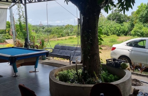 Agdangan House | Your cozy retreat surrounded by nature.nEnjoy our huge terrace with pool table.