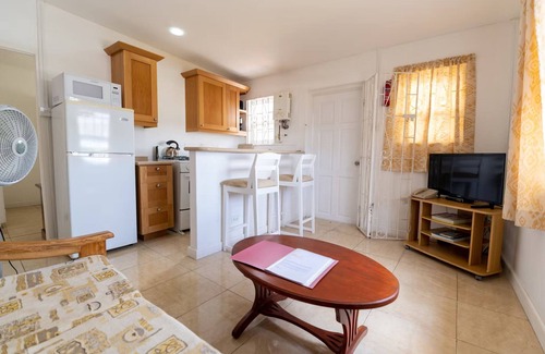 Blue Waters Hotel | Your Home Away from Home by Rockley Beach; Pool, Gardens & Full Kitchen