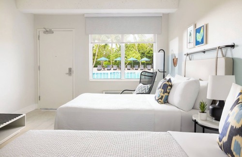 New Town Hotel | Your Island Base | 3 Pool View Rooms at Fun & Breezy Blue Flamingo Resort