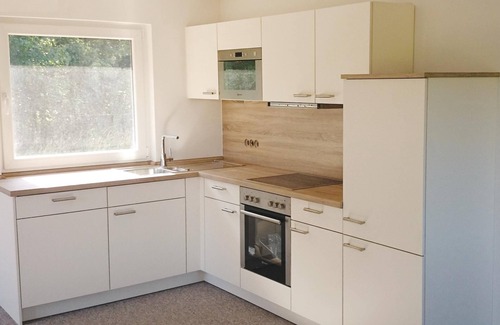 Heidmuhlen House | Your modern, high-quality holiday home is located in a quiet, wooded area near Bad Segeberg.