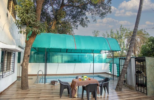 Khatri Park Housing Society Villa | Your private oasis awaits - a 4 BHK villa with a pool near the city."