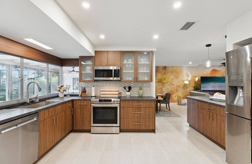 Venetian Way House | Your Ultimate Coastal Retreat! Stunning 4-Bed Canal-Front Home w/Pool & Lanai