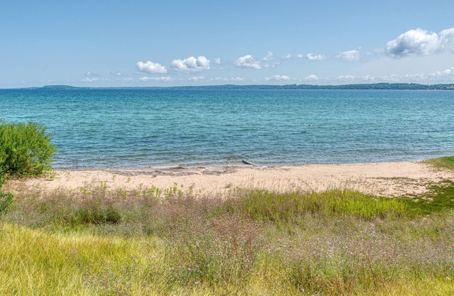100 ft of private sandy beach on West Bay 3 miles from downtown TC. Lic#2022-53