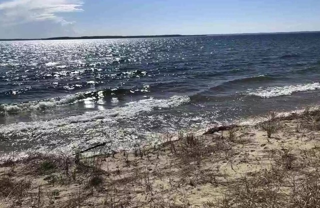 100' gorgeous sandy GT bay frontage only 15 miles from TC