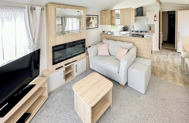 12ft-wide luxury caravan with one double with en suite shower and one twin.