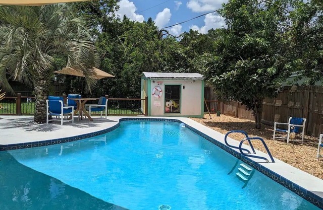 3 bed/2 bath house with tropical backyard, pool, fenced yard, hammock