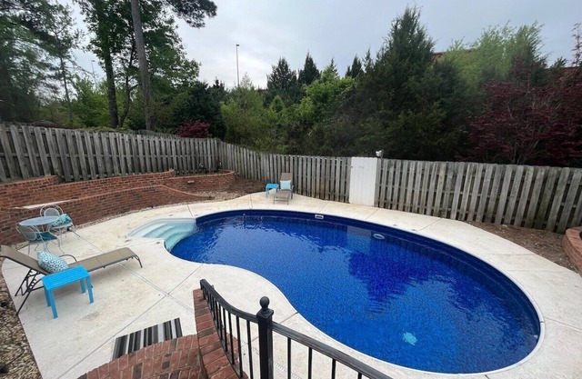 3 bedroom, 2.5 bathroom patio home with an inground pool. The sleeping arrangements at this property include three queen beds and a futon located in the second living room.