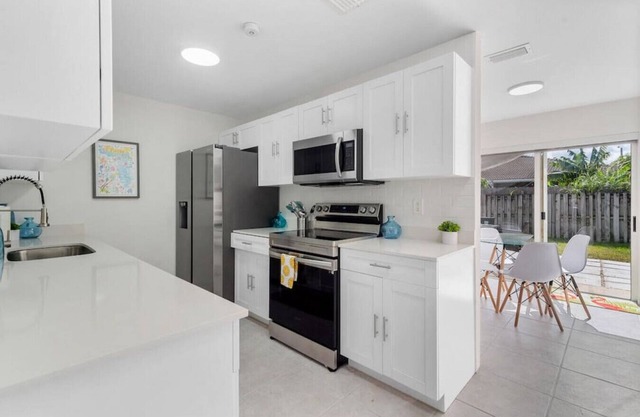 3 Bedroom 2 Bathroom with a BRAND NEW POOL W/ a huge backyard & BBQ next to Keys