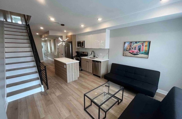 4 bed bi-level with roof deck. In the city.