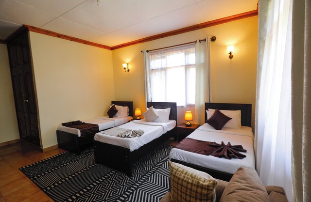 6-bedroom lodge in charming Arusha with AC, WiFi. Enjoy a cozy stay
