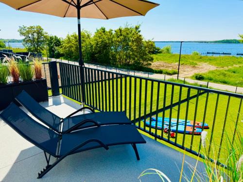 8 Personen Ferienhaus ,Seegelblick" am Goitzschesee, erste Reihe am Strand mit Sauna, Kamin, Wallbox & SUP