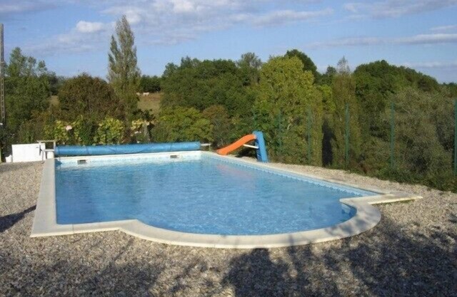 A barn in very peaceful setting with pool and great views