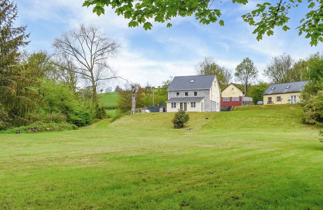 A beautiful farmhouse set within large gardens.