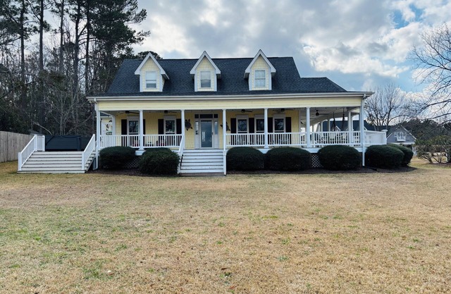A charming 3-bed/3.5 bath home with in-ground pool and jacuzzi on Pages Creek