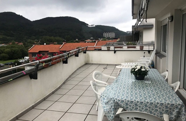 a cozy and charming pennhouse with a wonderful view