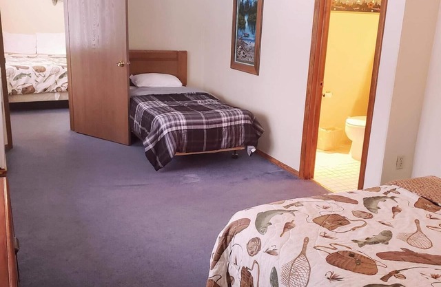 A fun fishing themed private guestroom for up to 5 inside the Lodge at North Ironwood Acres resort. TWO bathrooms! DOG FRIENDLY!.