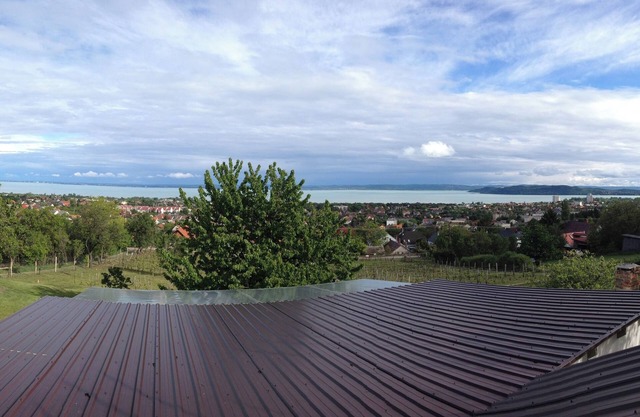 A newly renovated old wine cellar with a view of Lake Balaton and the city.