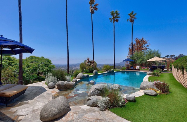 A private oasis to relax and play in the comfort of a gated 2-acre estate.