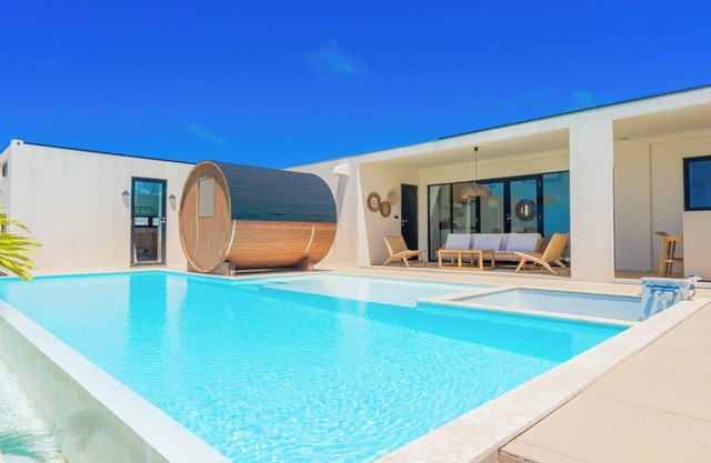 A private villa with a pool jacuzzi and sauna overlooking the ocean from a high vantage point/Miyakojima Okinawa