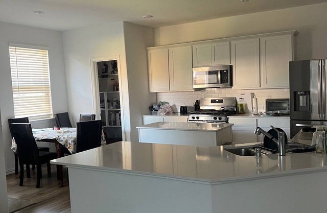 A Room in a charming brand new house with kitchen, AC, and WiFi in McKinney