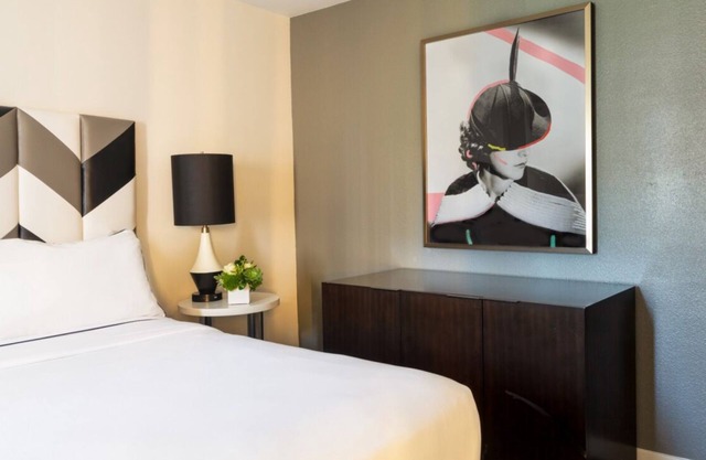 A Sophisticated Suite! Four Units with Furnished Living, Rooftop Pool, Balcony!