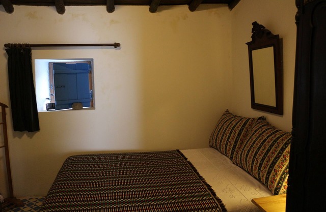 a traditional house with many books and garden