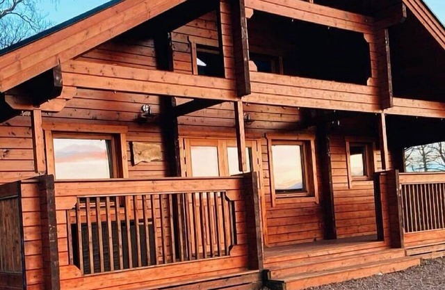 A traditional Scandinavian style lodge, with stylish wooden interior decorated with a Scottish theme
