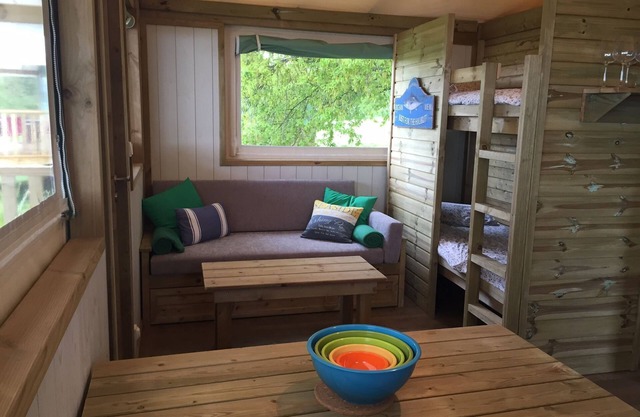 A two bedroom luxury lodge with extra cabin beds, heated covered pool