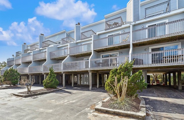 Activities included up to $300 FREE PER WEEK! NEW LISTING 2024! Beautifully decorated vacation townhome in North Bethany approximately 300 feet from the beach and nestled behind the dunes with a private boardwalk taking you out to the surf and sand!
