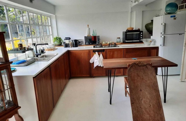Adorable and spacious independent studio on garden level with patio.
