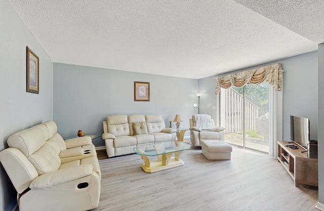 All-suite Bay Tree retreat with al fresco dining, water views, and shared pool