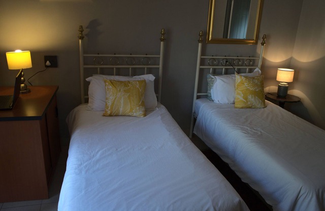 Aloha Lodge spacious bedroom, sleeps 2, with its own entrance and a garden view