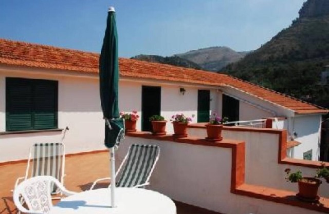AN OLD FARMHOUSE SET IN A CITRUS GROVE