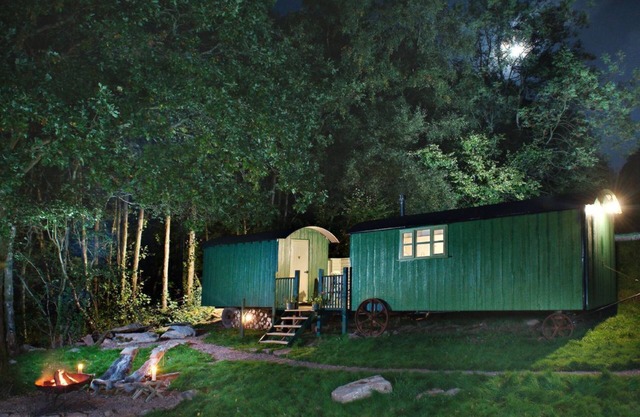 Anne's Hut offers a romantic retreat for two in two interlinked shepherd's huts with decking area an