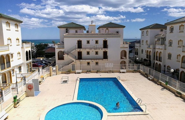 Apartment Casa Cozy with Sea View, Pool, Wi-Fi, A/C & Terrace