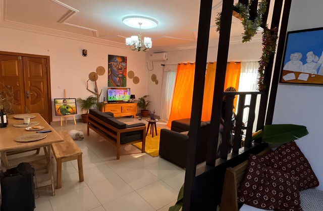 Apartment decorated with natural plants and artistic paintings.