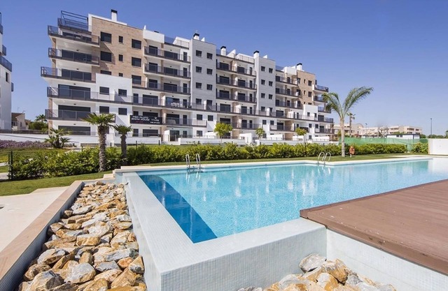 Apartment in Mil Palmeras with Sea View, Pool, Garden, Terrace, A/C & Wi-Fi