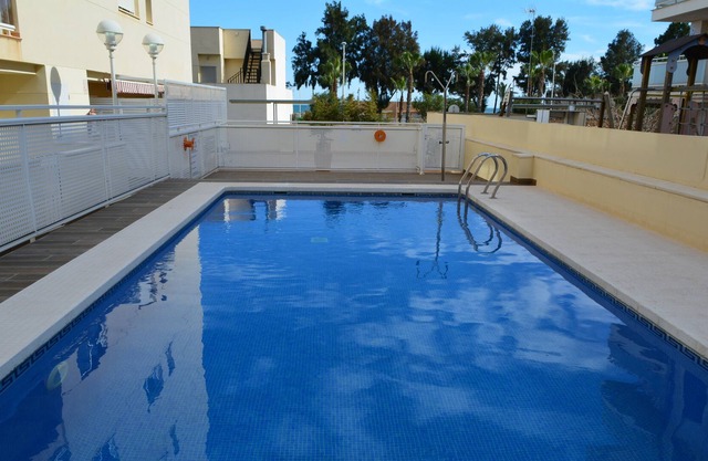 Apartment on the beach with pool, terrace and garage