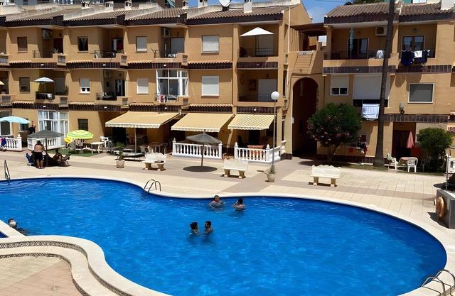 Apartment 'Punta Prima Getaway' with Shared Pool, Wi-Fi and Air Conditioning