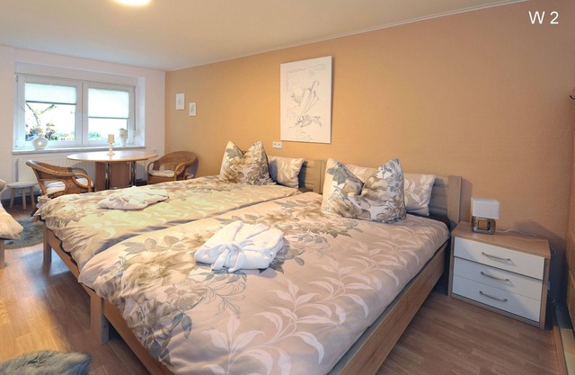 Apartment Rita 2, bedroom, living room, kitchen, shower/WC, outdoor seating area - Ferienwohnungen Rita